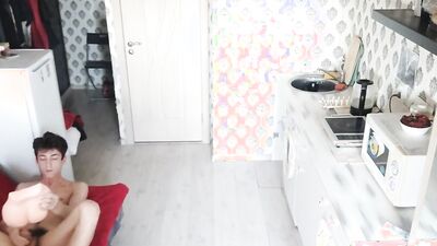 Skinny chap is playing with his gummy toy inside the kitchen