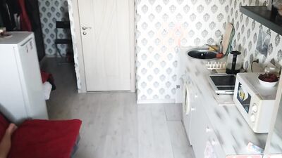 Skinny chap is playing with his gummy toy inside the kitchen