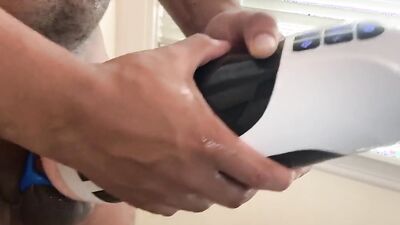 Close-up video of a chap stroking his prick with a toy
