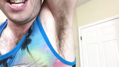 Adam Castle is flashing his arm pit in front of the camera