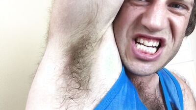 Adam Castle is flashing his arm pit in front of the camera