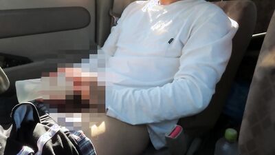 Amateur Japanese bloke is stroking his cock while driving a van