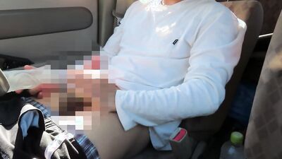 Amateur Japanese bloke is stroking his cock while driving a van