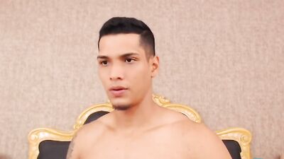 Cute Latino chap is stroking his willy in front of the cam
