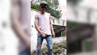 Skinny amateur chap is jerking his prick out in the open