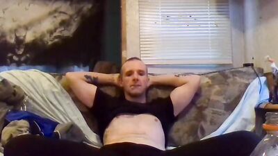 Perverted amateur bloke is stroking his tiny pecker on the couch