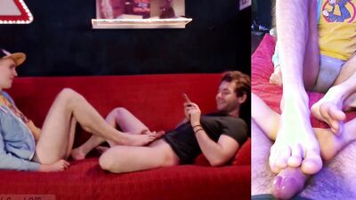 Perverted bloke gives his roommate a footjob while been filmed