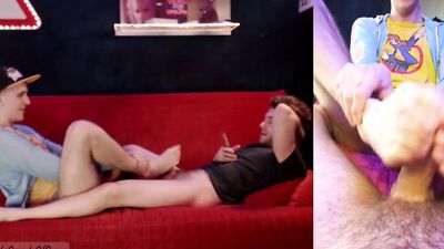 Perverted bloke gives his roommate a footjob while been filmed