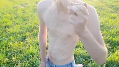 Skinny European bloke lays with his dong out in the fields