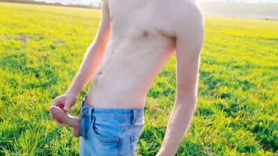 Skinny European bloke lays with his dong out in the fields