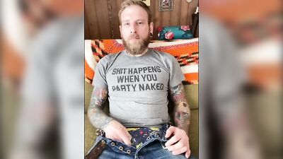 Tattooed bearded fellow is stroking his prick in this solo performance