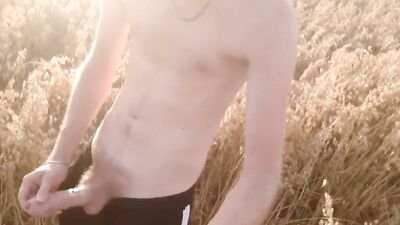 Russian bloke is stroking his huge dong out in the fields