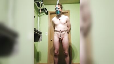 Tied-up lad is posing in front of the camera