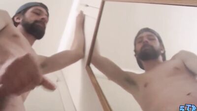 Bearded straight bloke is jerking off in front of the mirror