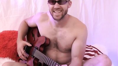 Amateur gay dude is playing a guitar naked in this solo performance