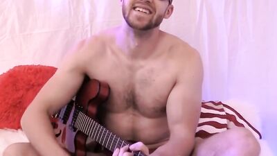Amateur gay dude is playing a guitar naked in this solo performance