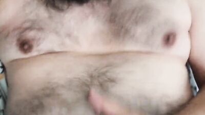 Bearded amateur gay chap films himself while stretching his cock