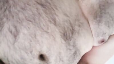 Bearded amateur gay chap films himself while stretching his cock