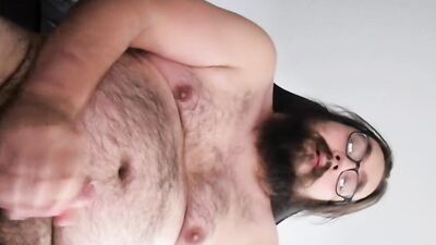 Bearded amateur gay chap films himself while stretching his cock