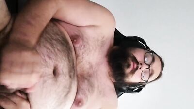 Bearded amateur gay chap films himself while stretching his cock