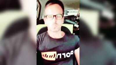 Horny dudes strokes his dick inside the car while smoking a cigarette