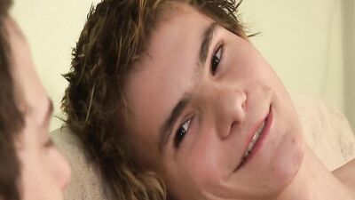 Two cute European twinks are shagging hard on the couch