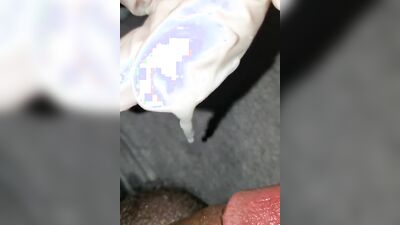 Close-up video of a chap stroking his prick while wearing a gloves