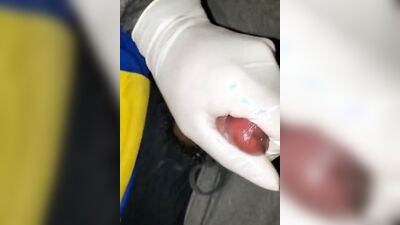 Close-up video of a chap stroking his prick while wearing a gloves