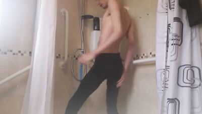 Skinny gay chap is stroking a pecker while taking a shower