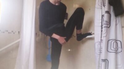 Skinny gay chap is stroking a pecker while taking a shower