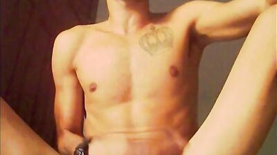 Skinny chap is stroking his wood in front of the camera