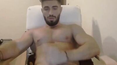 Straight fella is stroking cock in front of the camera