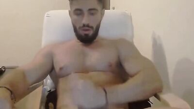 Straight fella is stroking cock in front of the camera