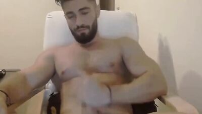 Straight fella is stroking cock in front of the camera
