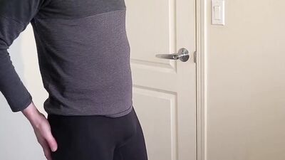 Skinny bloke is showing his ass wearing a tight yoga pants