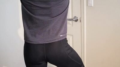 Skinny bloke is showing his ass wearing a tight yoga pants