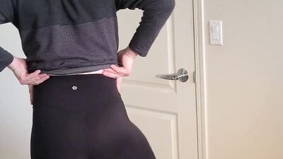 Skinny bloke is showing his ass wearing a tight yoga pants