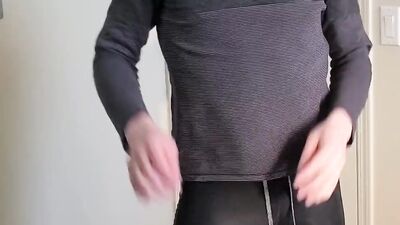 Skinny bloke is showing his ass wearing a tight yoga pants