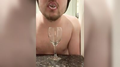 Perverted bloke is spitting inside the glass in this solo performance