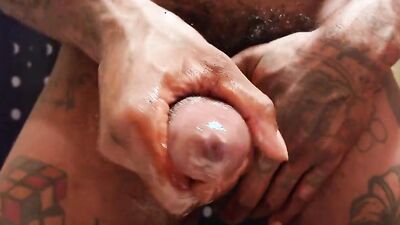 Lad jerks his monster cock in this close-u video