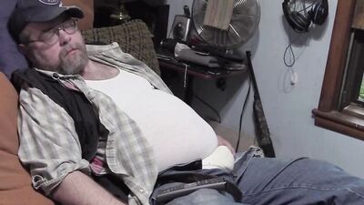 Chubby stepdad is playing with genitals in front of the cam