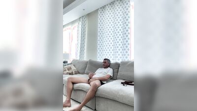 Amateur fellow is masturbating on the couch in this homemade footage