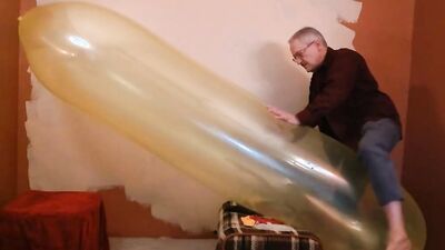 Perverted stepdad plays with huge balloon in front of the camera