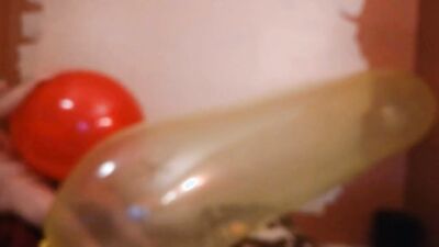 Perverted stepdad plays with huge balloon in front of the camera