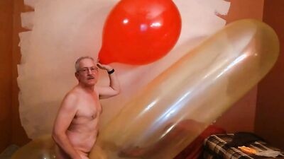 Perverted stepdad plays with huge balloon in front of the camera