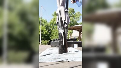 Amateur bloke rides his enormous black toy in the backyard