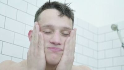 Handsome straight bloke is playing with a cock inside the bathroom