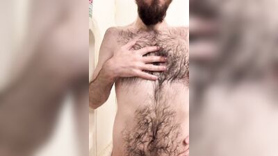 Amateur bear is posing naked in front of the camera
