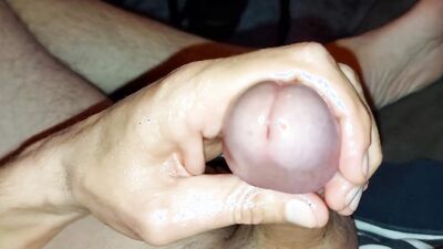 Close-up footage of a dude stroking his huge piston