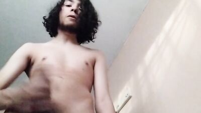 Longhairrd dude is jerking his dick in front of the phone